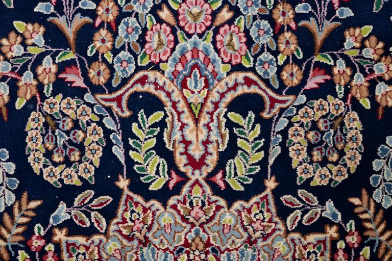 An oriental carpet, c. 385 x 300 cm.
