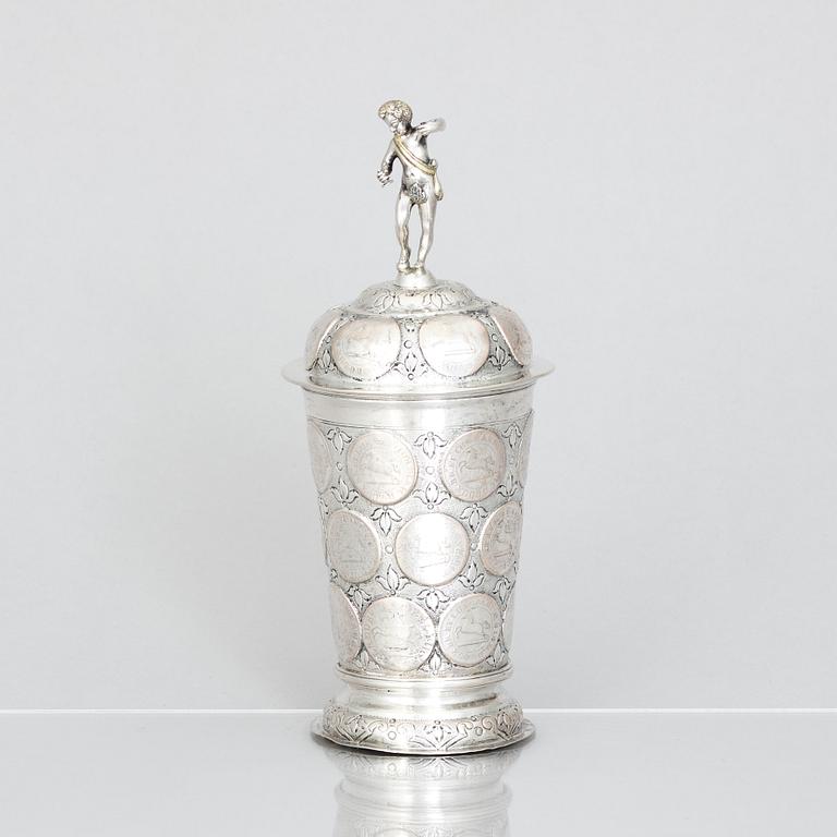 An 19th century parcel-gilt silver cup with lid, unidentified makers mark, probably Nürnberg.