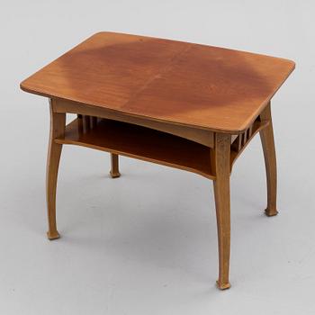 An early 20th century table with 4 chairs.