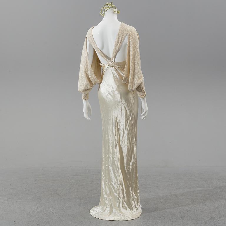 A satin wedding dress, circa 1935.