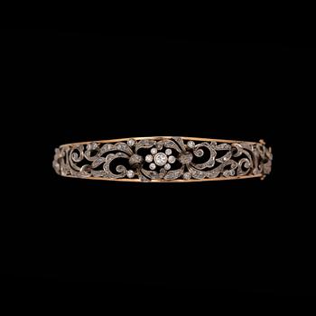 45. A brilliant- and rose cut diamond bangle.