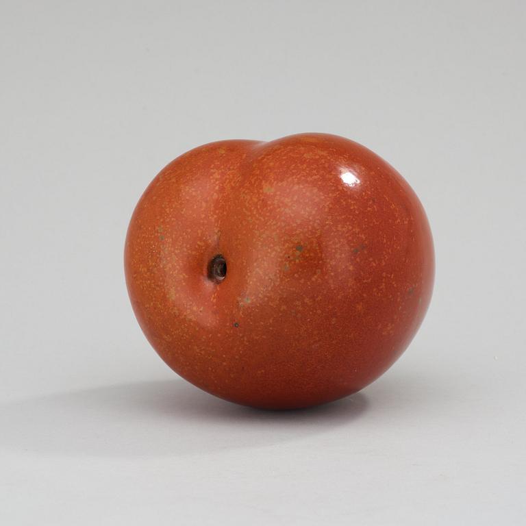 A Hans Hedberg faience sculpture of a plum, Biot, France.