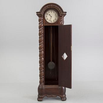 An early 20th century art nouveau grandfather clock.