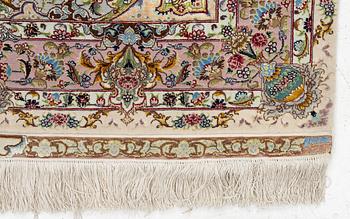 A Tabriz rug, signed, c. 160 x 101 cm.