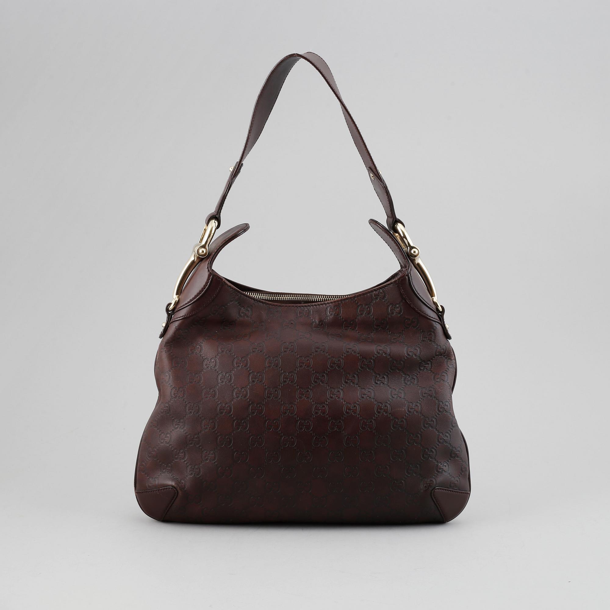Gucci, a leather bag.