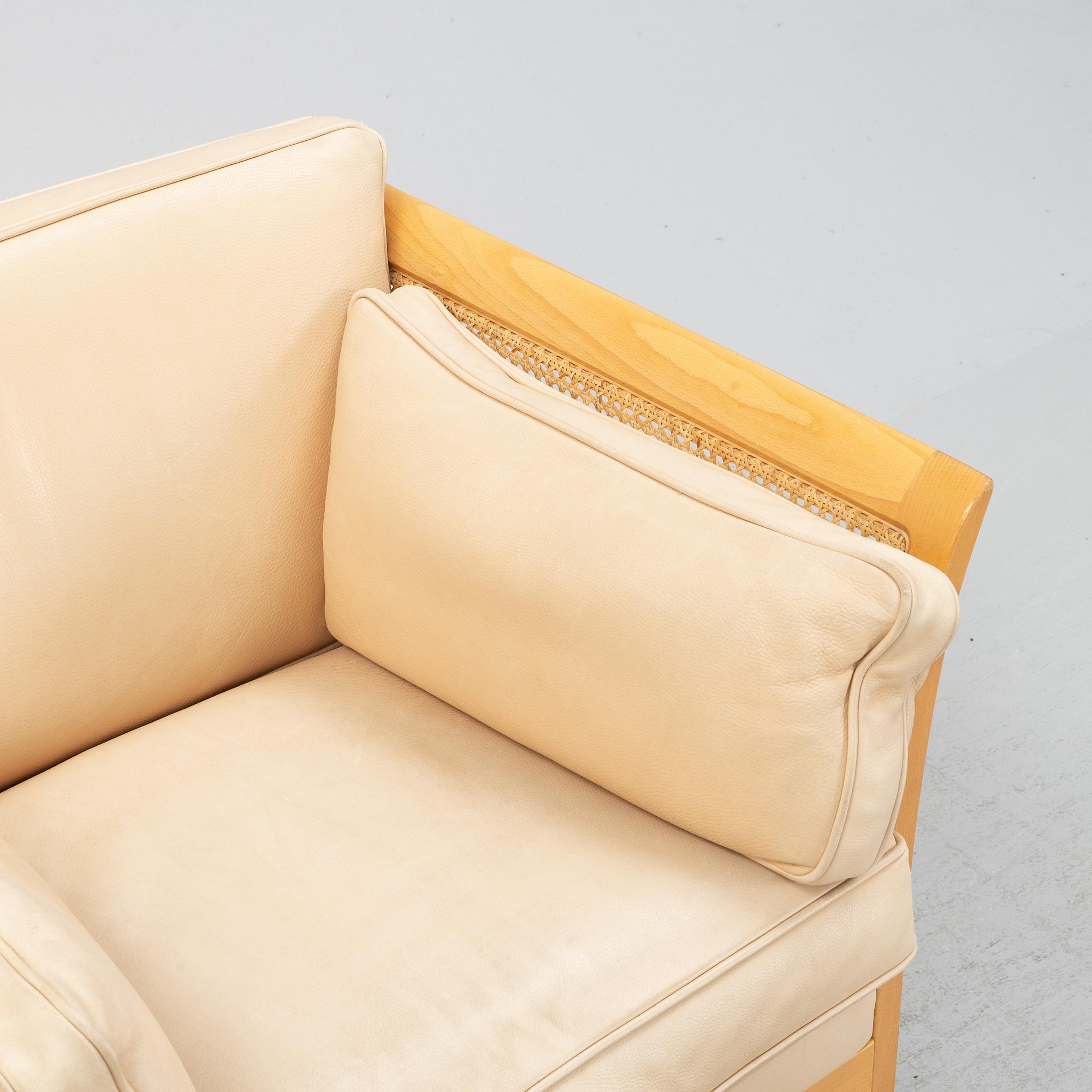 A pair of 'Rotan' easy chairs by Arne Norell, end of the 20th Century.