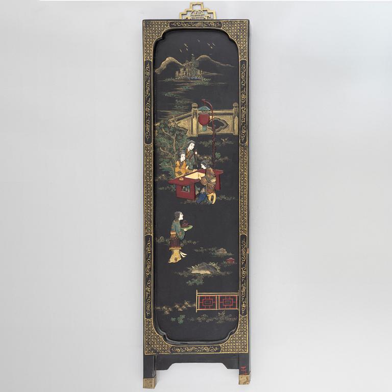 Four black-lacquered wall decorations, China, around 1900.