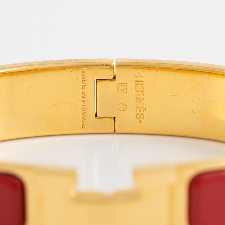 Hermès, a 'Clic H' bracelet.