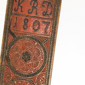 A painted wooden mangle board, Southern Sweden, dated 1807.