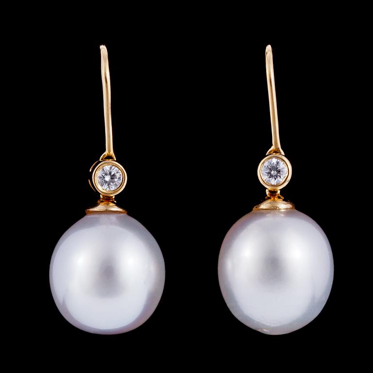 A pair of cultured South sea pearl, 13 mm, and brilliant cut diamond earrings, tot. 0 .23 cts.