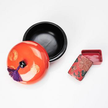 Three Japanese lacquer boxes with covers.