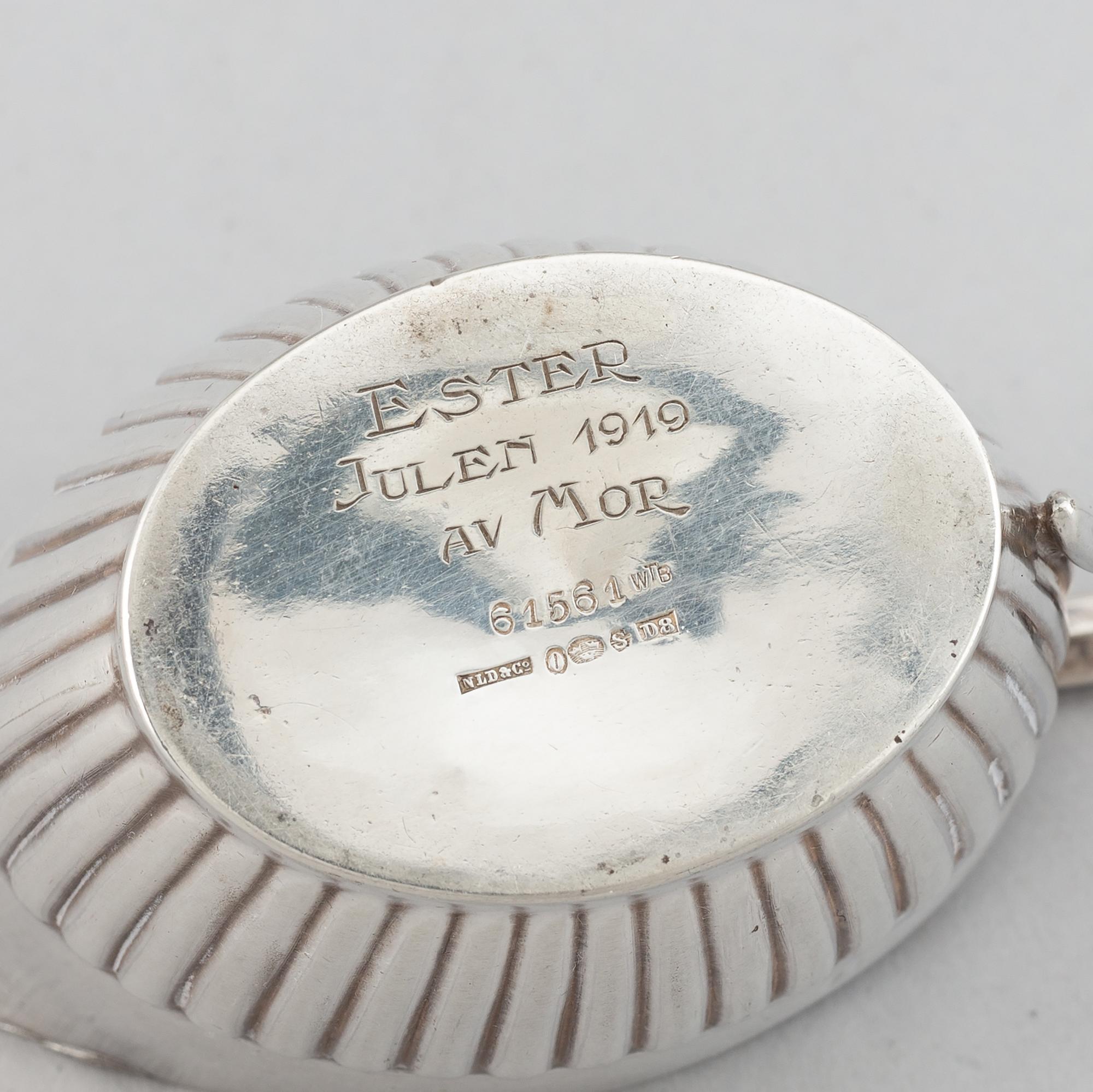 A silver mocha pot, creamer and sugar bowl, swedish import mark of NL Dahlström & Co, Örebro 1930.