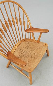 A Hans J Wegner ash and teak 'Peacock chair', Johannes Hansen, Denmark.