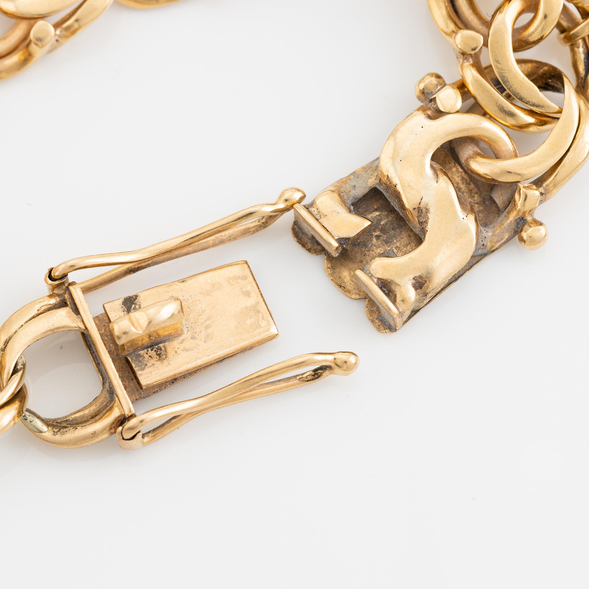 Gold charm bracelet.