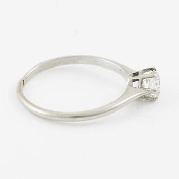 Platinum ring with brilliant-cut diamond.