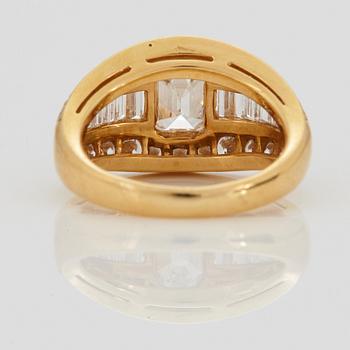 A RING set with an emerald-cut diamond.