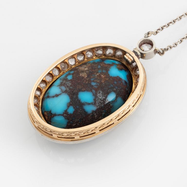 A turquoise pendant in platinum and 14K gold set with old- and rosecut diamonds.