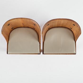 Axel Einar Hjorth, a pair of stained pine "Lovö" armchairs, Nordiska Kompaniet, Sweden, 1930s.