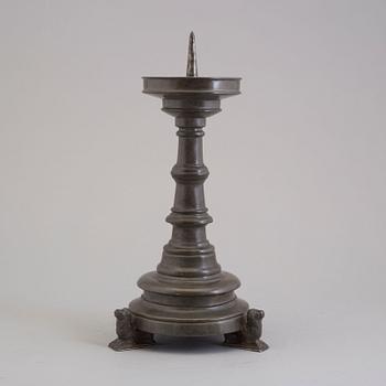 A 18th century pewter candlestick.