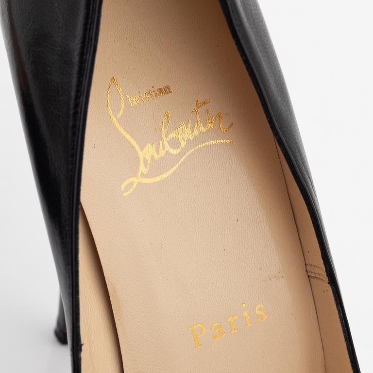 Christian Louboutin, a pair of black leather peep toe pumps, size 37 1/2.