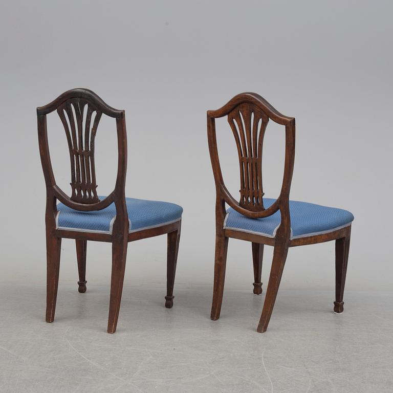 A 19th century dining table and a set of twelve chairs.