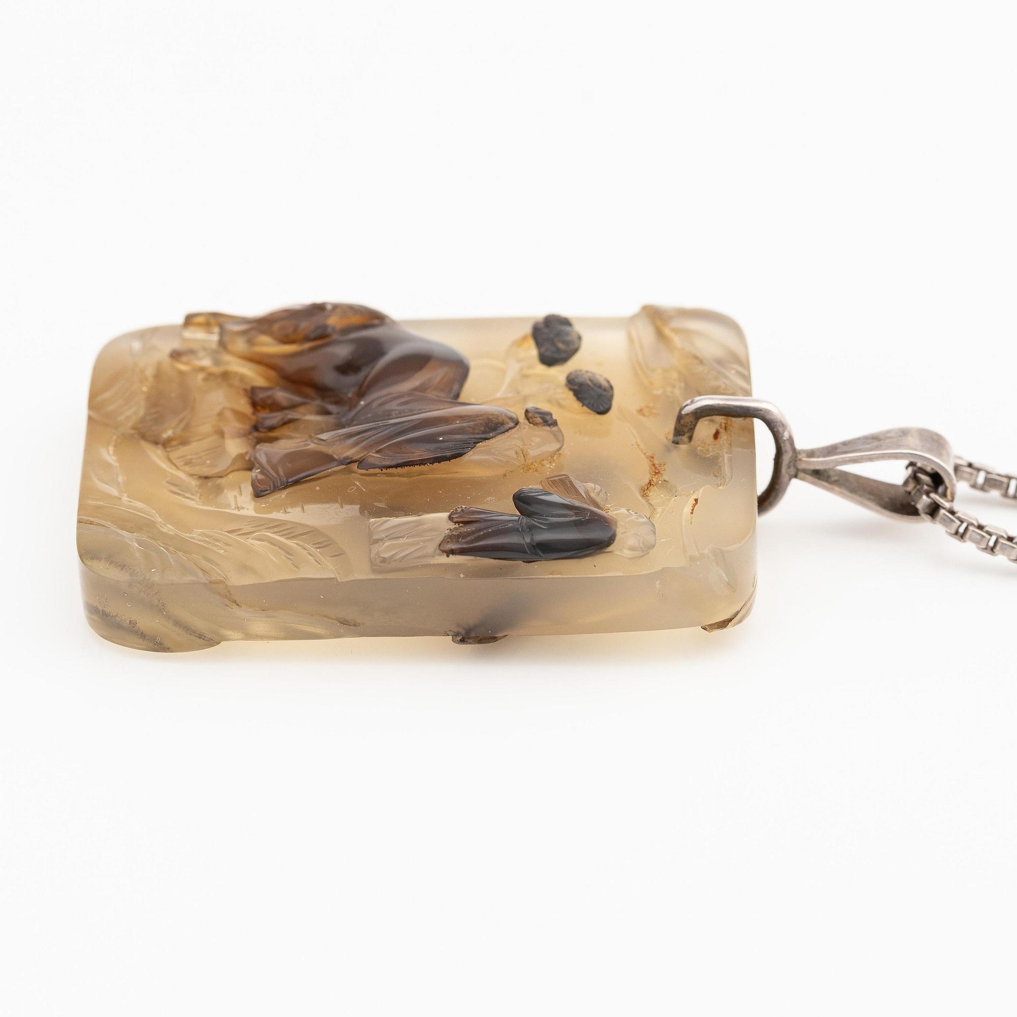 An inscribed and well carved agate 'Scholar and attendant' pendant, Qing dynasty, probably 19th century.