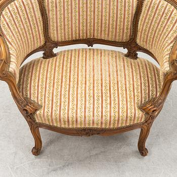 A Louis XV style marquise chair, around the year 1900.