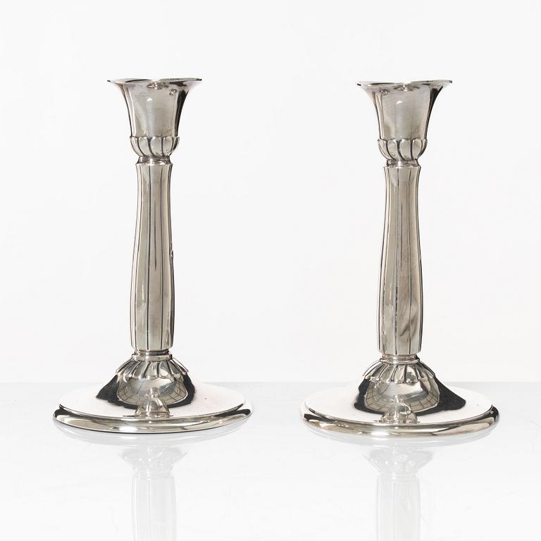 A pair of silver candle sticks, first half of the 20th century.