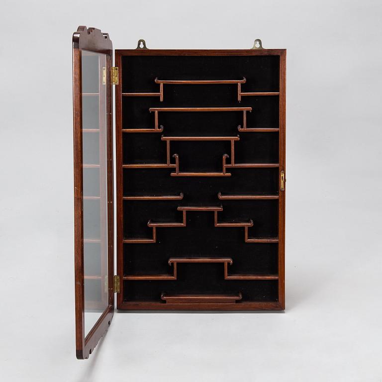 A Chinese 20th century hardwood wall cabinet.