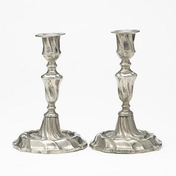A pair of Swedish Rococo pewter candlesticks by L Lundwall 1762.