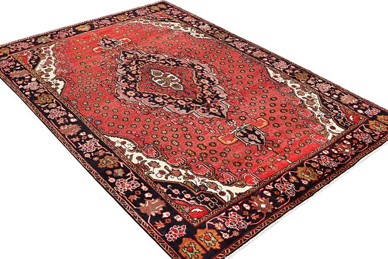 An Azerbaijan carpet, c. 306 x 208 cm.