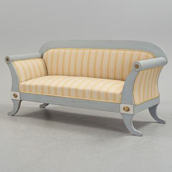 A mid 19th century painted sofa.