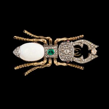 210. A BROOCH, opal c. 13.00 ct, emerald c. 0.5 ct, old cut diamonds c. 1.6 ct, rubies.