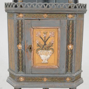 Corner cabinet from the first half of the 19th century.