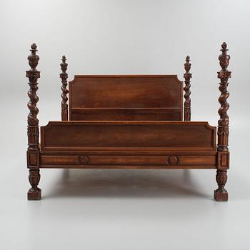 A carved Baroque style bed, early 20th Century.