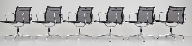 A set of six Charles and Ray Eames 'Aluminium Group chairs EA 108' by Vitra.