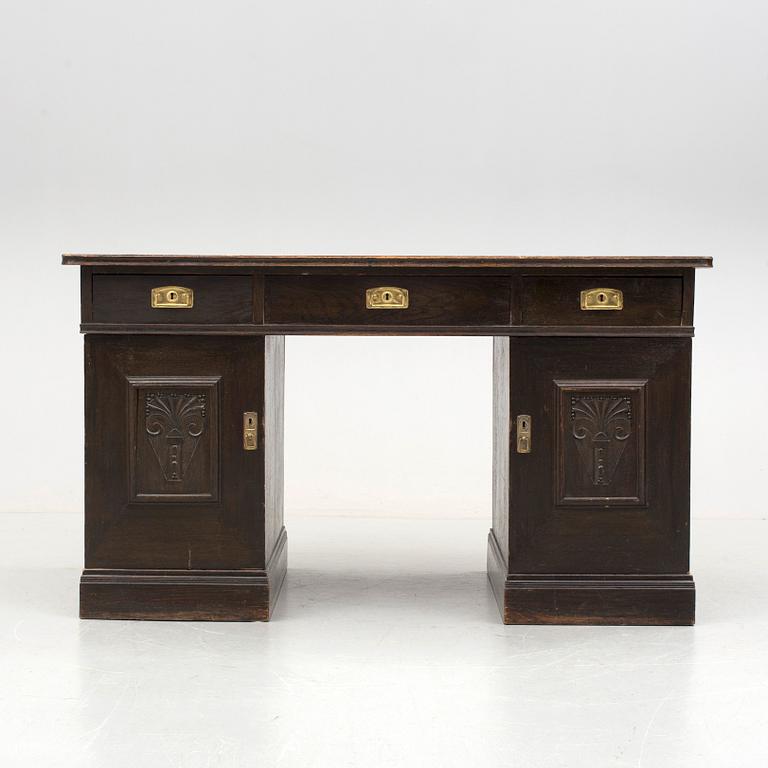 An early 1900s oak writing desk.