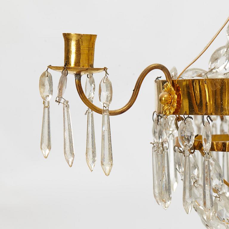 A late Gustavian gilt-brass and cut-glass four-branch chandelier, circa 1800.