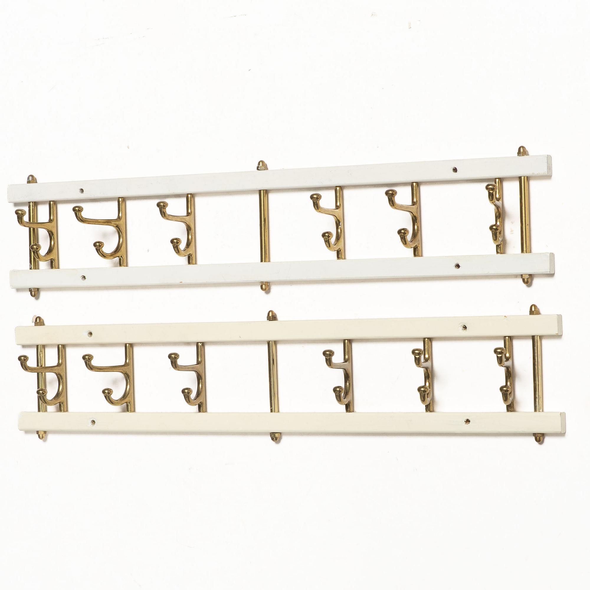 Coat hangers, a pair, “Dekorativ”, Skoglunds Metallgjuteri, Anderstorp, mid-20th century.