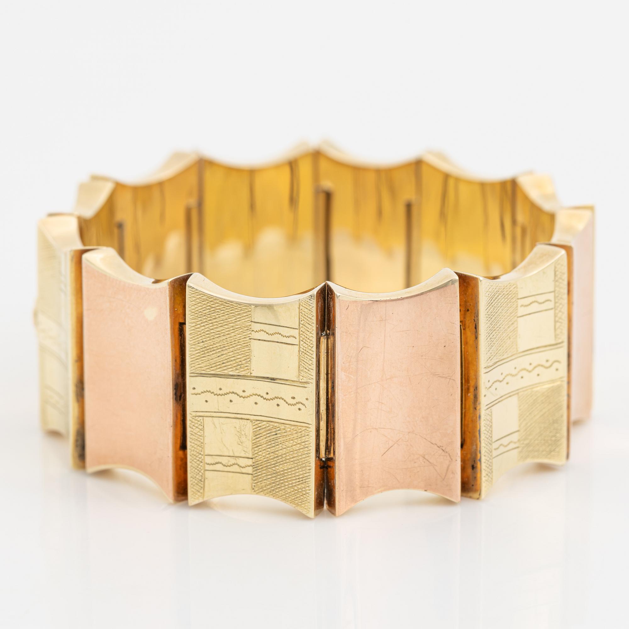 A 14K gold bracelet.