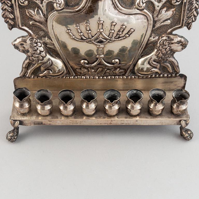 A 19th century silver chanukka-lamp.