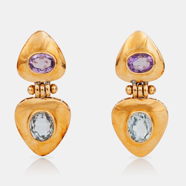 A pair of amethyst and aquamarine earrings.