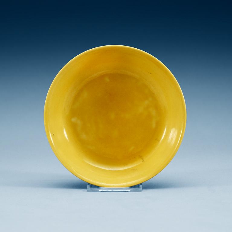 A yellow glazed dish, Ming dynasty with Zhengdes six character mark and of the period.