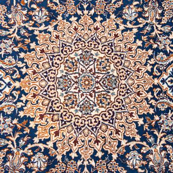 A carpet, Nain, part silk, ca. 295 x 201 cm.