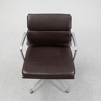 An EA 208 Soft Pad swivel chair by Charles and Ray Eames for Vitra, dated 2010.