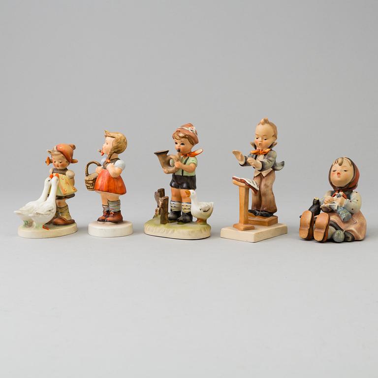 Five porcelain figurines, mostly Goebel.