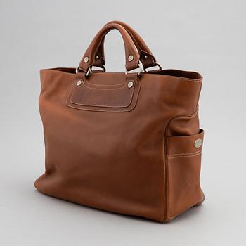 Céline, a leather handbag.