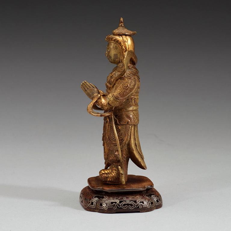 A gilt bronze figure of a Lokapala, Qing dynasty, 19th Century.