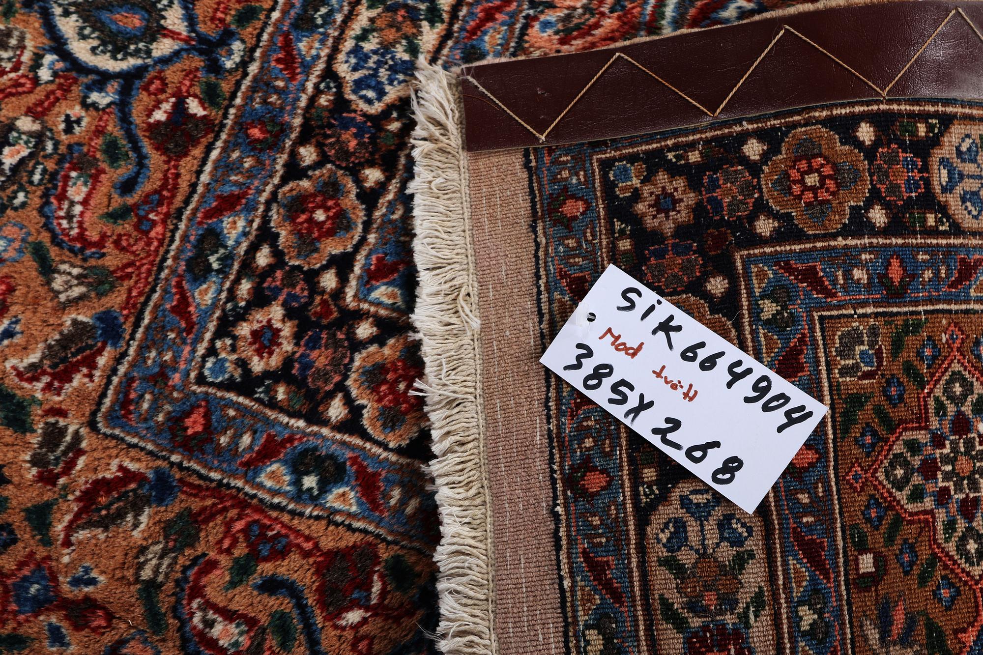 A carpet, Moud, signed, ca 385 x 268 cm.