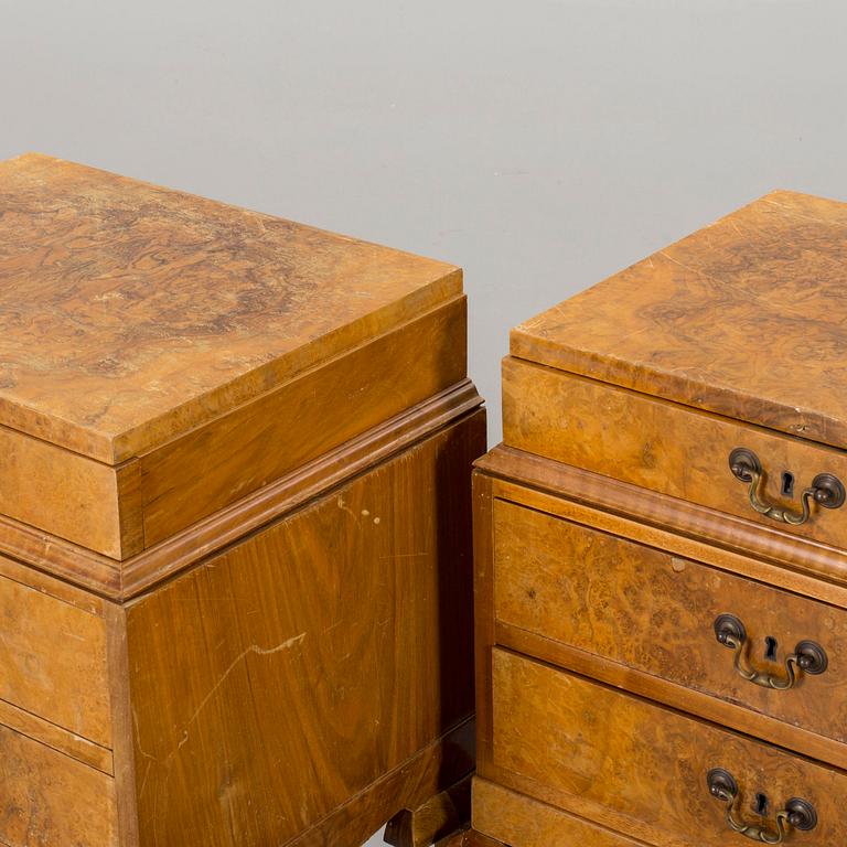 A pair of Rococo-style bedside tables.